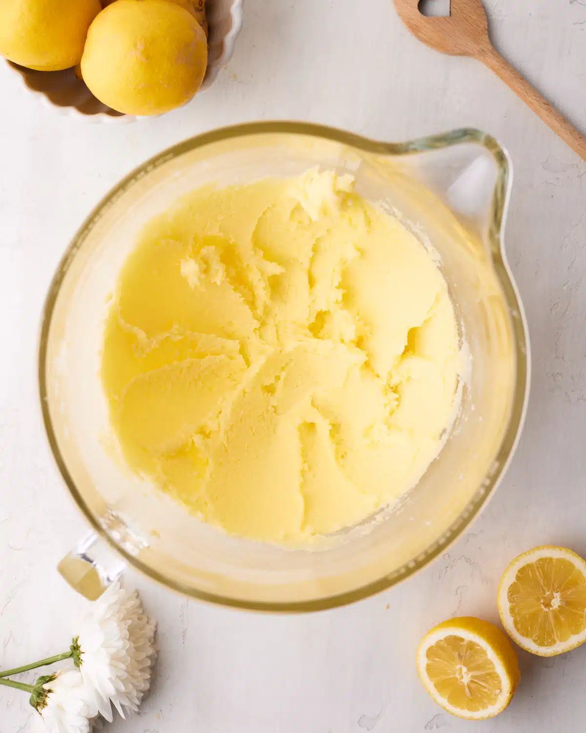 Butter and sugar creamed together to make lemon drizzle cake. 