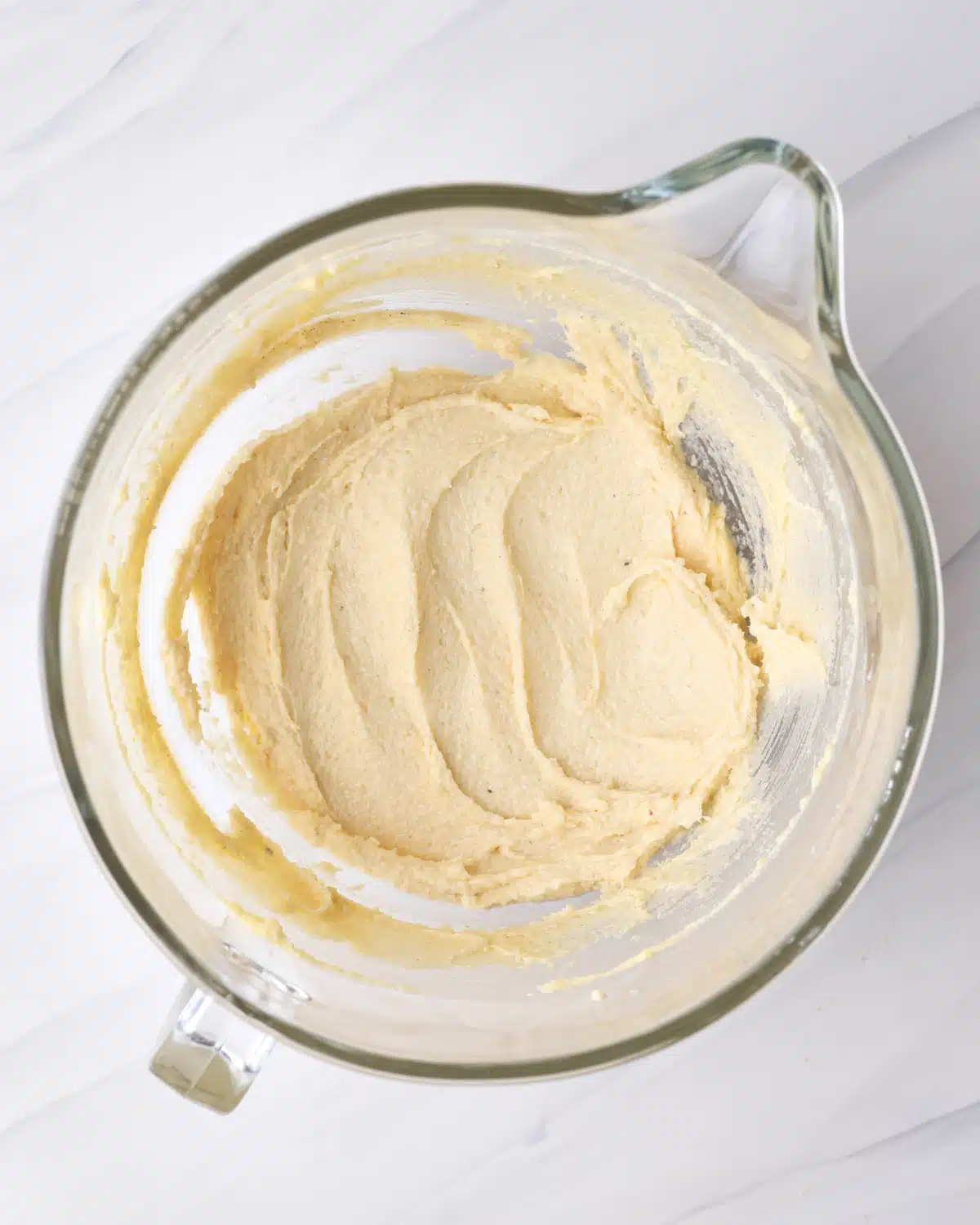 Frangipane (almond cream) in a glass bowl, ready to make bakewell tart.