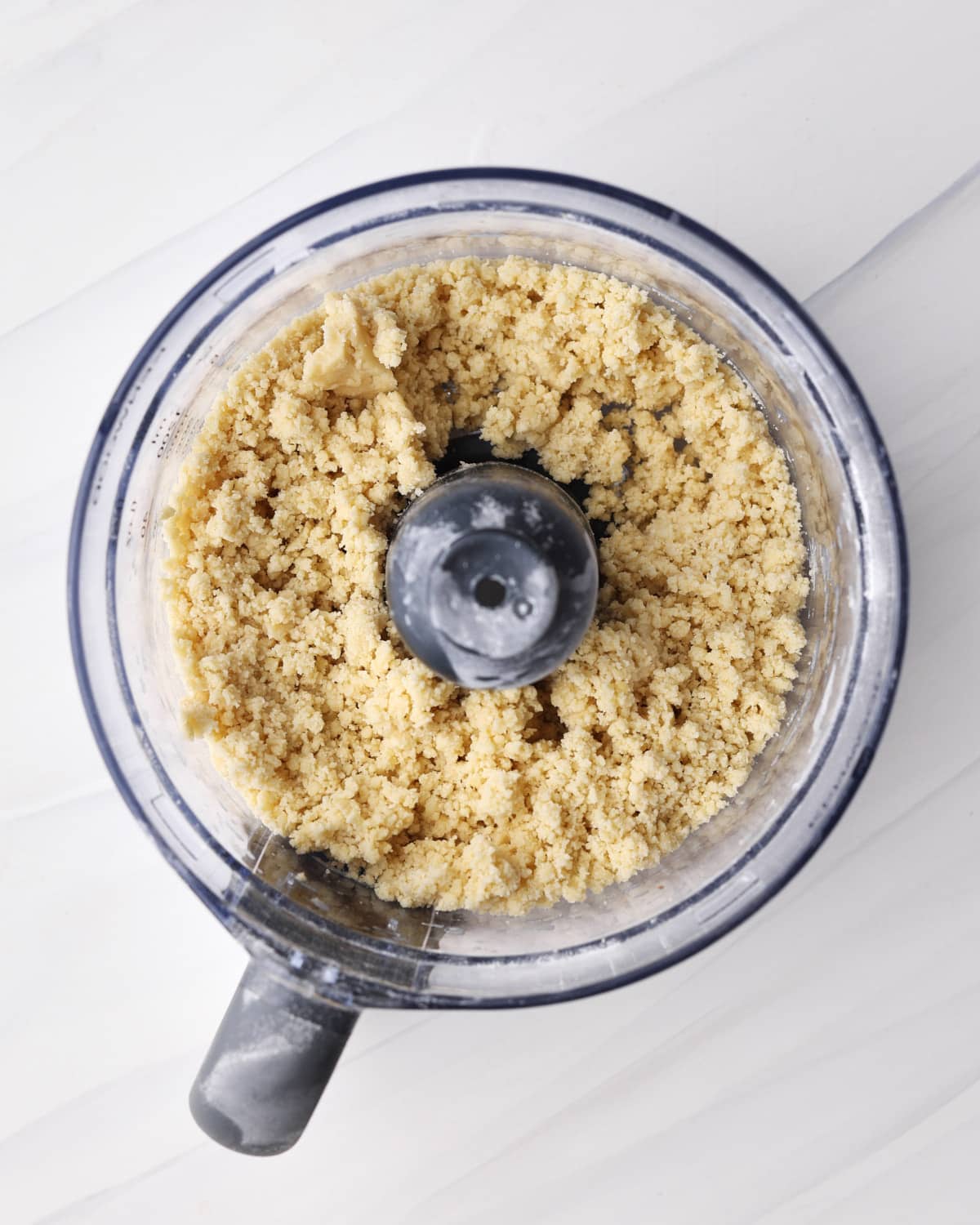Process shot of making shortcrust pastry in the food processor.