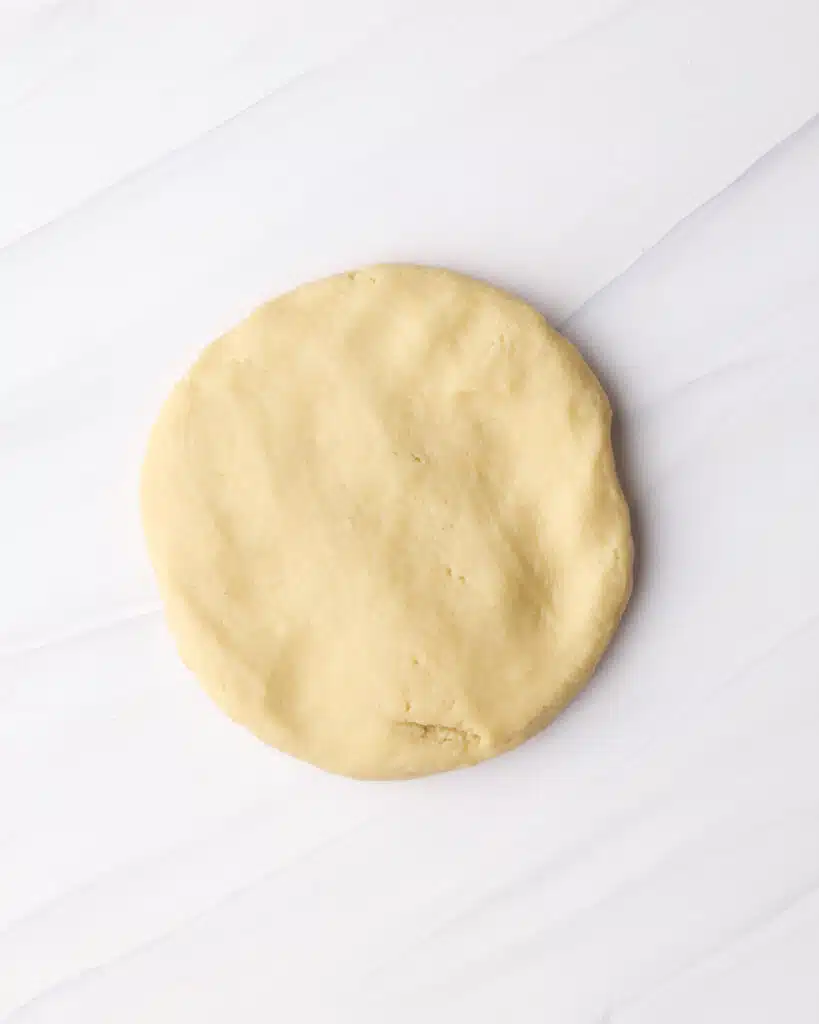 Disk of shortcrust pastry ready to be chilled before making a tart shell.