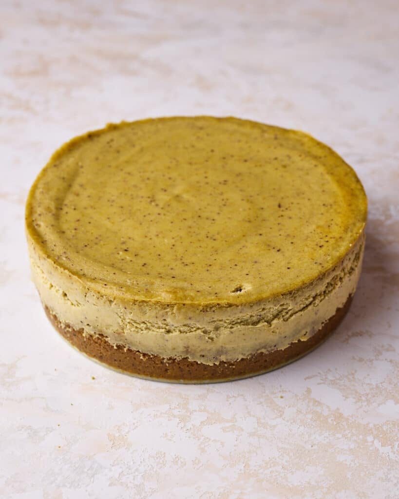 Baked pistachio cheesecake once it has cooled and been removed from the pan. 