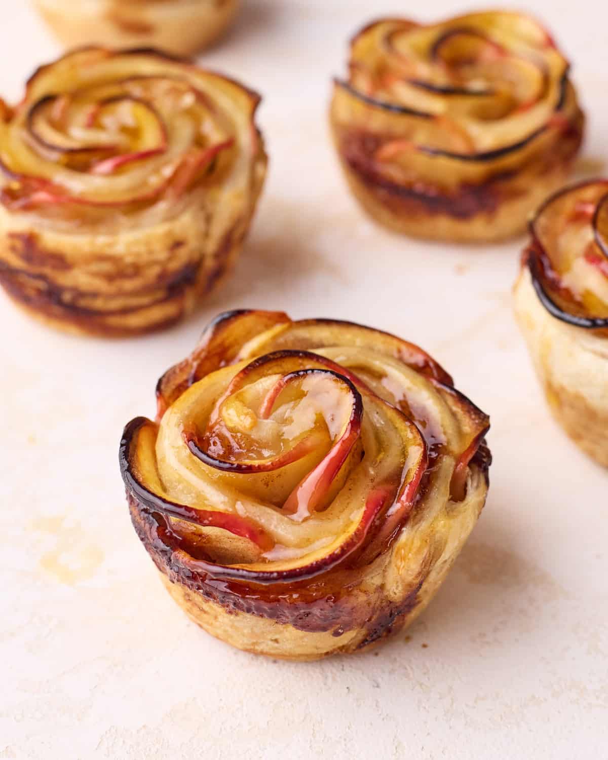 Close up of baked apple roses showing the intricate rose design. 