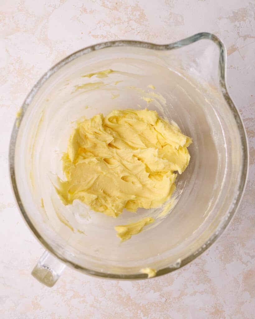 Process shot of creaming butter and powdered sugar together to make dough for Danish butter cookies. 