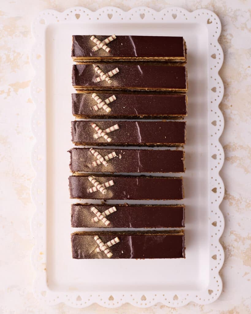 Individual slices of Opera cake on a serving plate. 