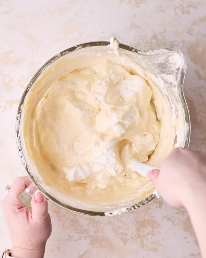 Folding meringue into almond mixture to make joconde sponge. 