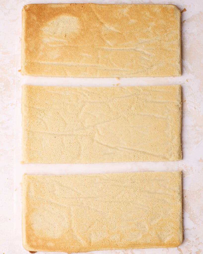 Joconde sponge cake cut into three rectangles to make the layers of an Opera cake. 