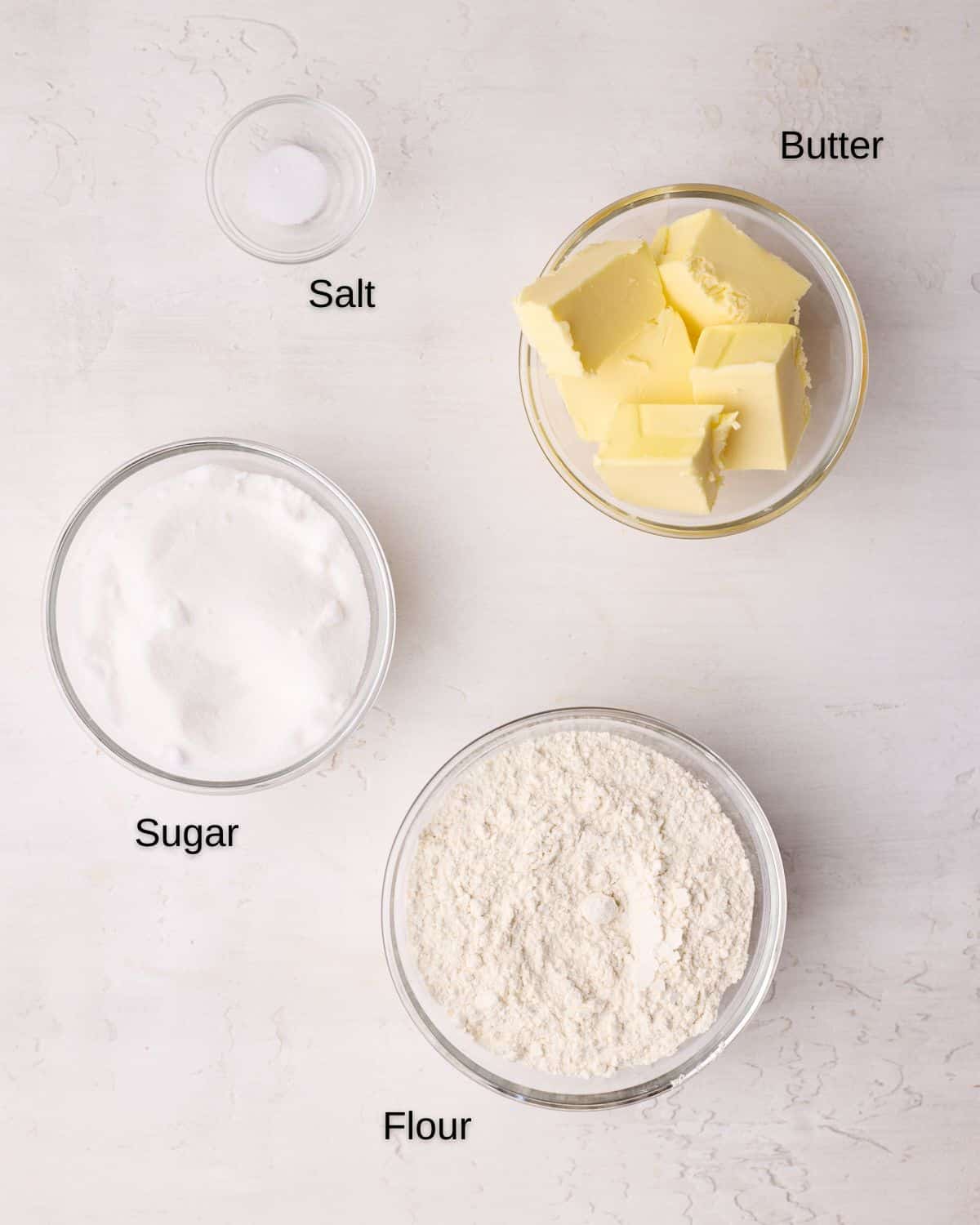 Ingredients to make crumble topping, including butter, flour, sugar and salt.