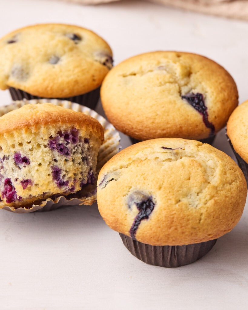 Baked blueberry muffins with nice round domed muffin tops. 