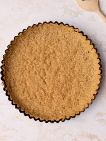 Finished Graham cracker crust in cake pan.