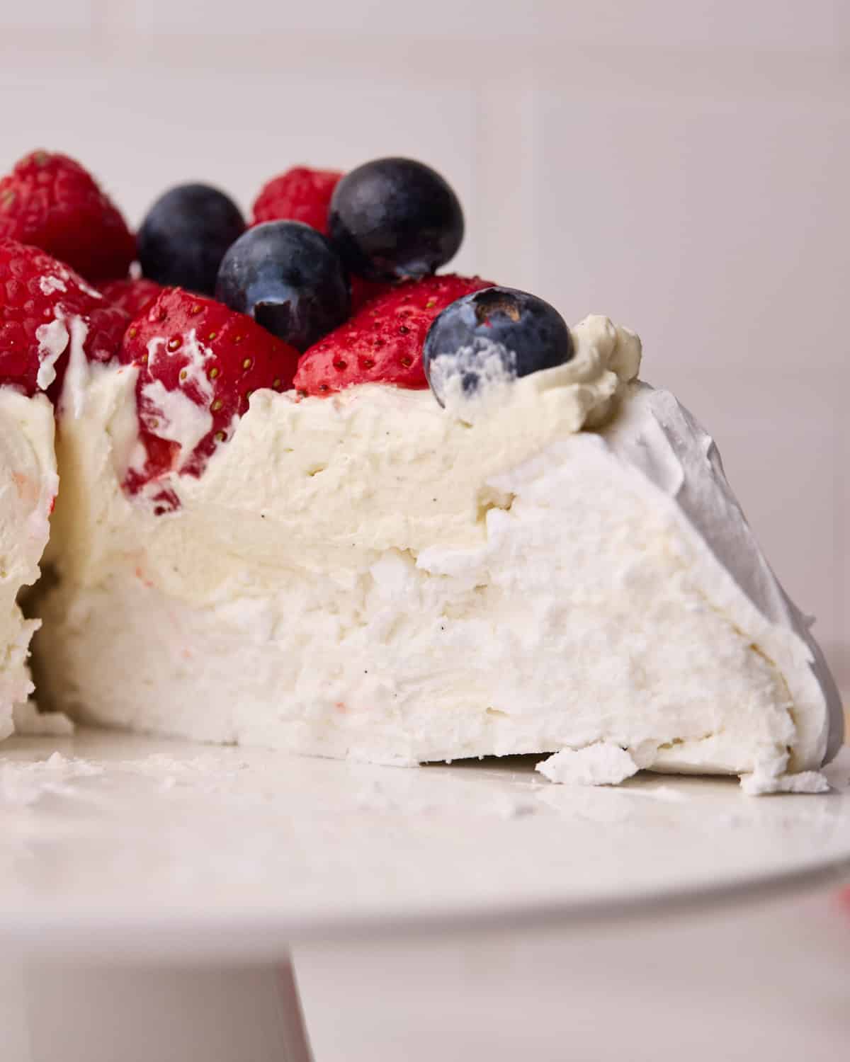 Close up of the inside of the pavlova, showing the creamy and chewy texture.