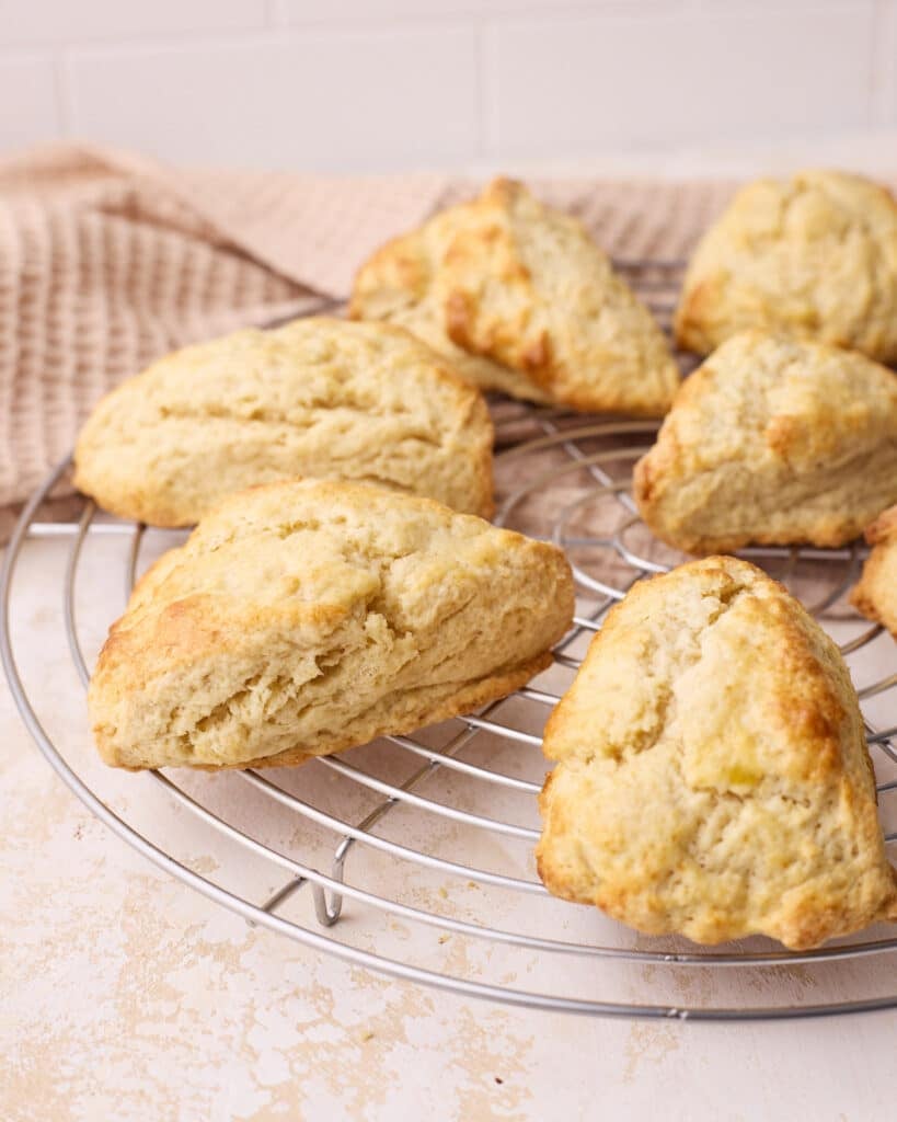 Freshly baked scones cooling on a wire rack.