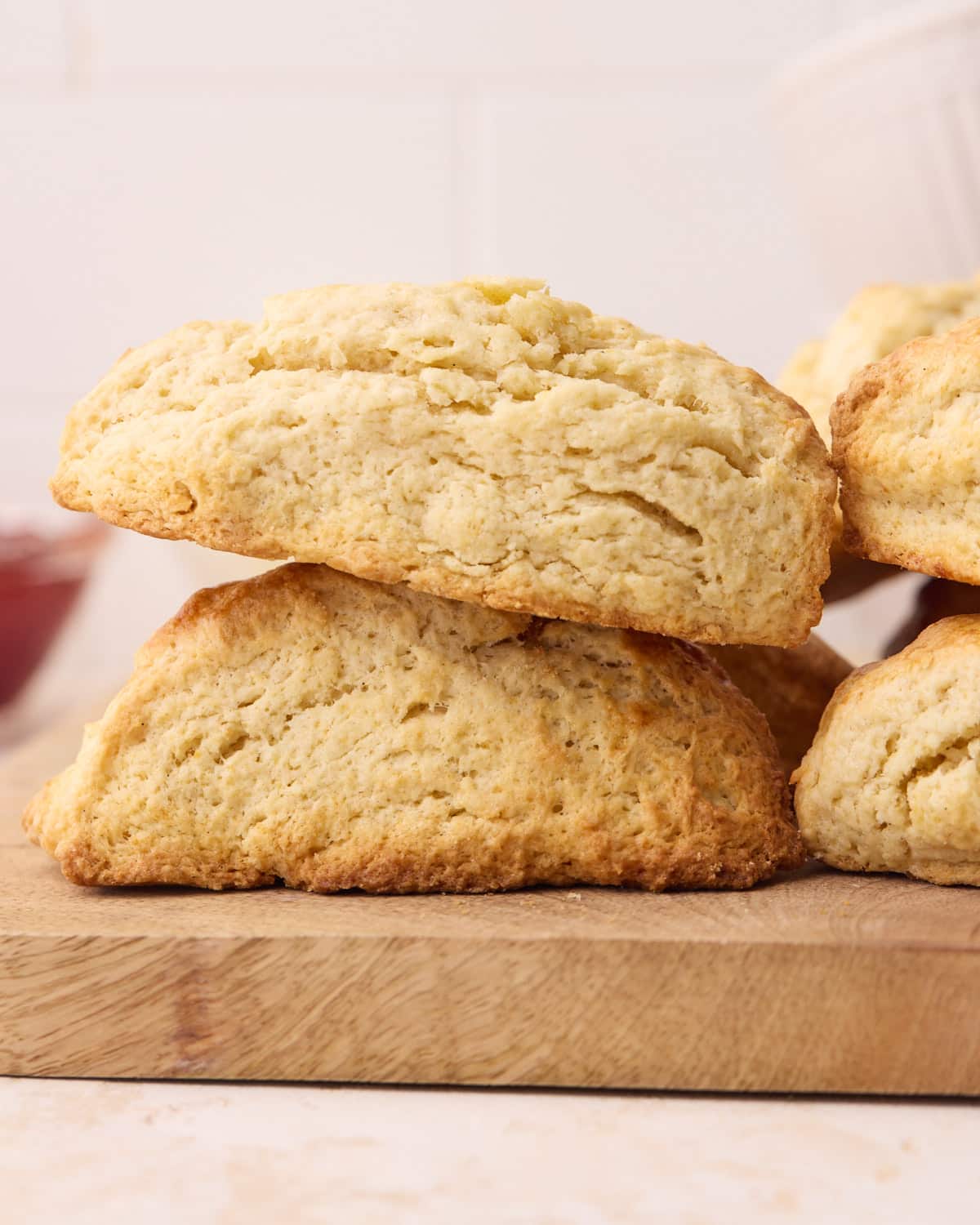 Close up side view of baked scones, with one on top of the other. 