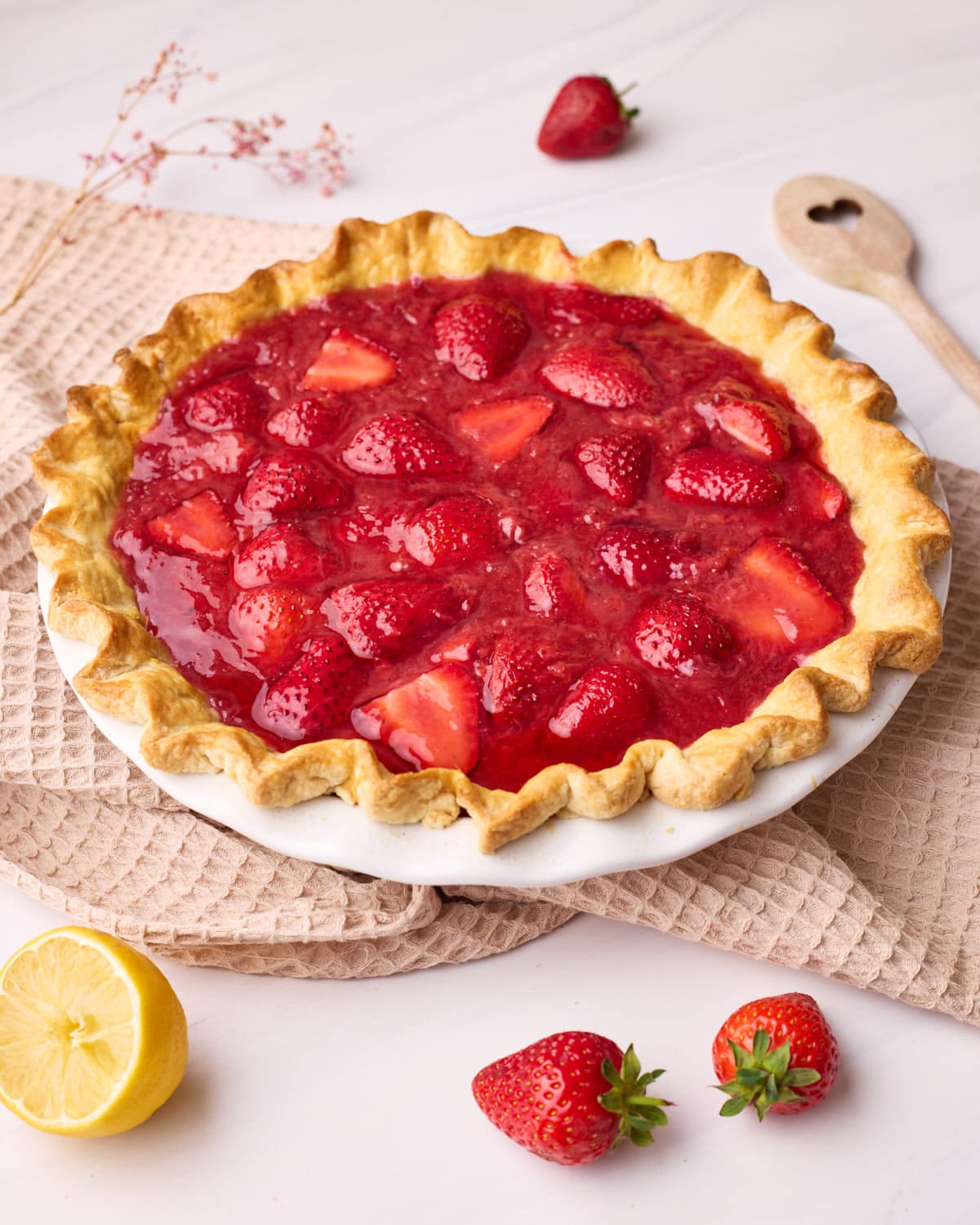 Finished strawberry pie pictured side on.