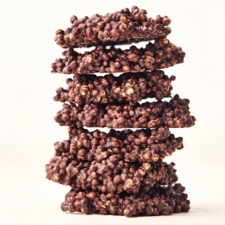 Chocolate quinoa crisps stacked up on top of eachother.