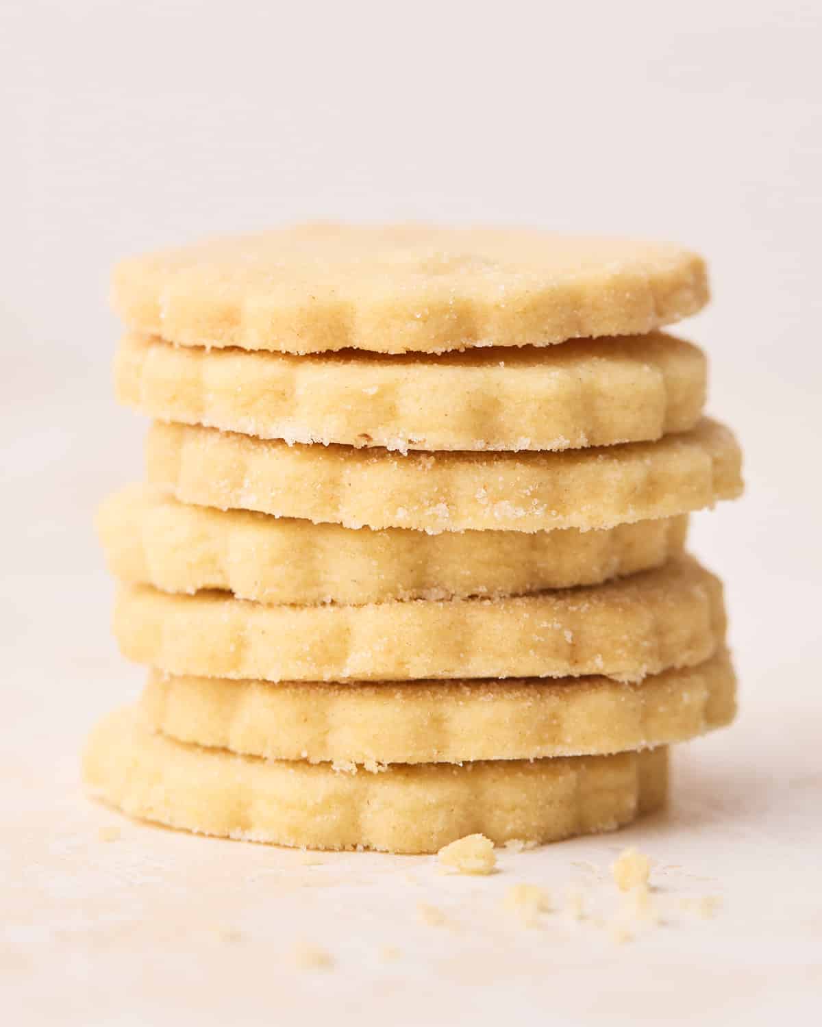 A close up of shortbread cookies stacked on top of each other.