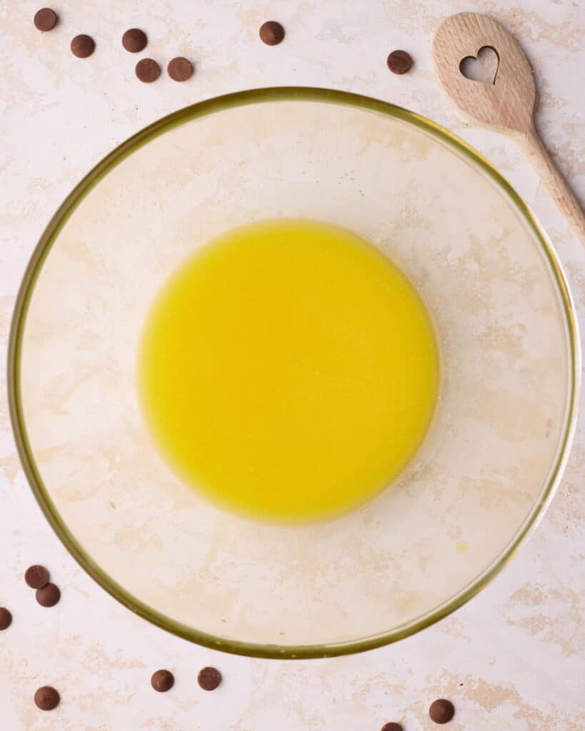 Melted butter cooling in a bowl.