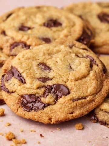 Close up of chocolate chip cookies overlapping each other.