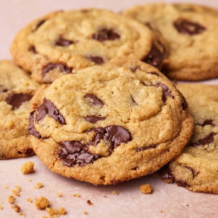 Close up of chocolate chip cookies overlapping each other.