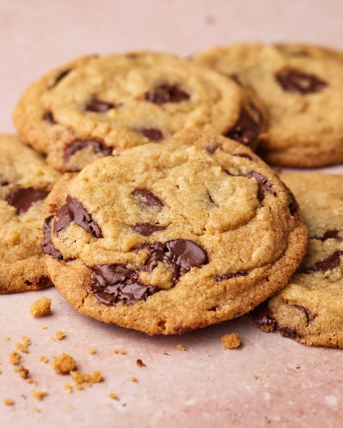 Close up of chocolate chip cookies overlapping each other.