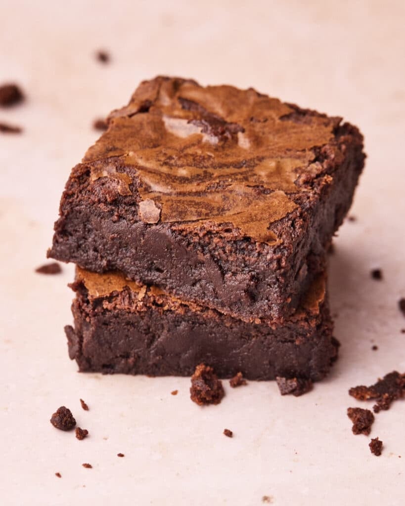 Overhead shot 2 fudgy brownies on top of each other.