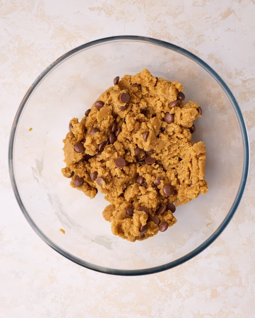 Pumpkin chocolate chip cookie dough in a bowl.