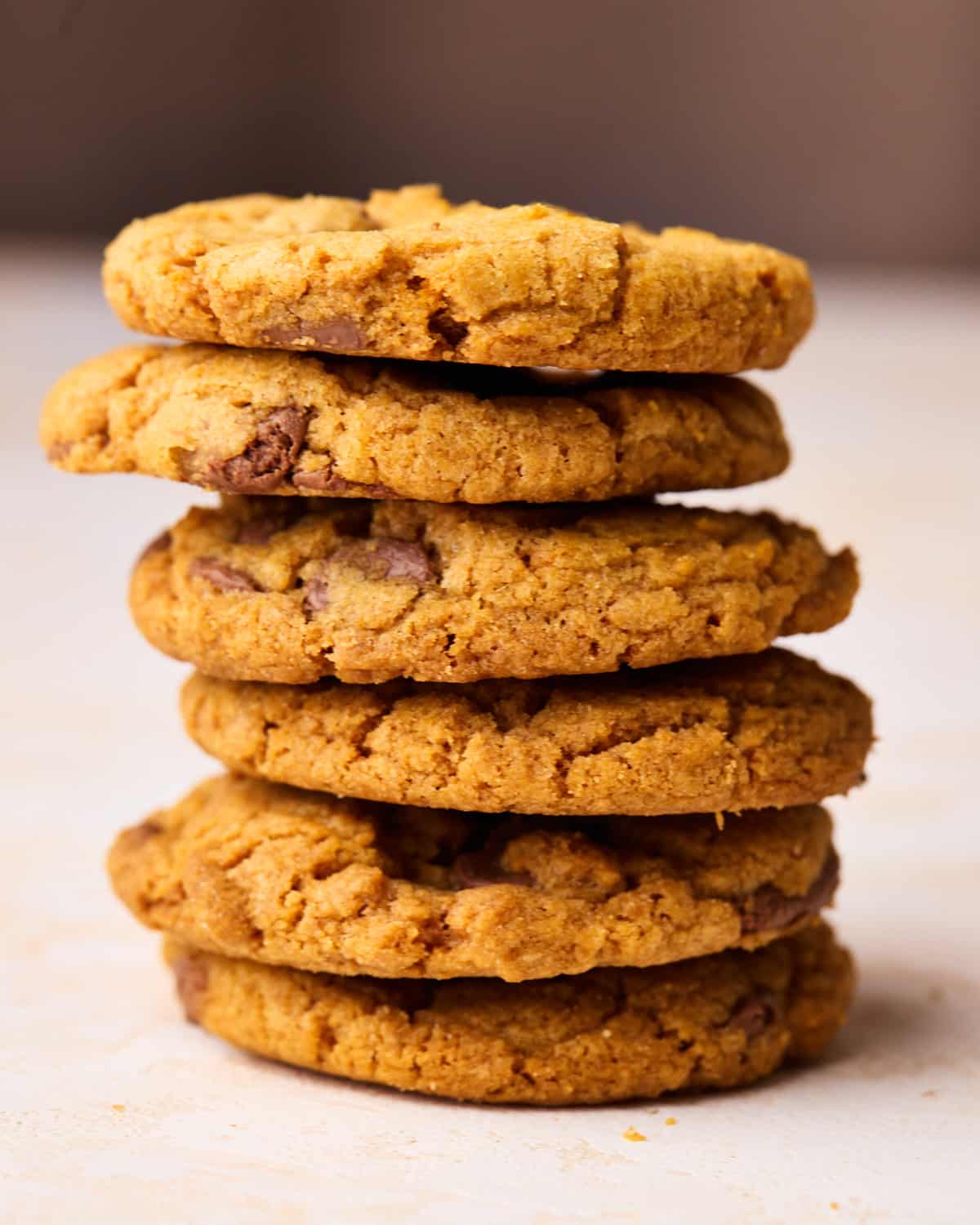 A tall stack of pumpkin chocolate chip cookies.