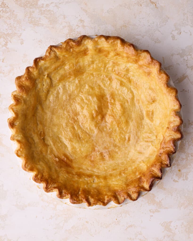 Baked flakey pie crust with golden brown edges.