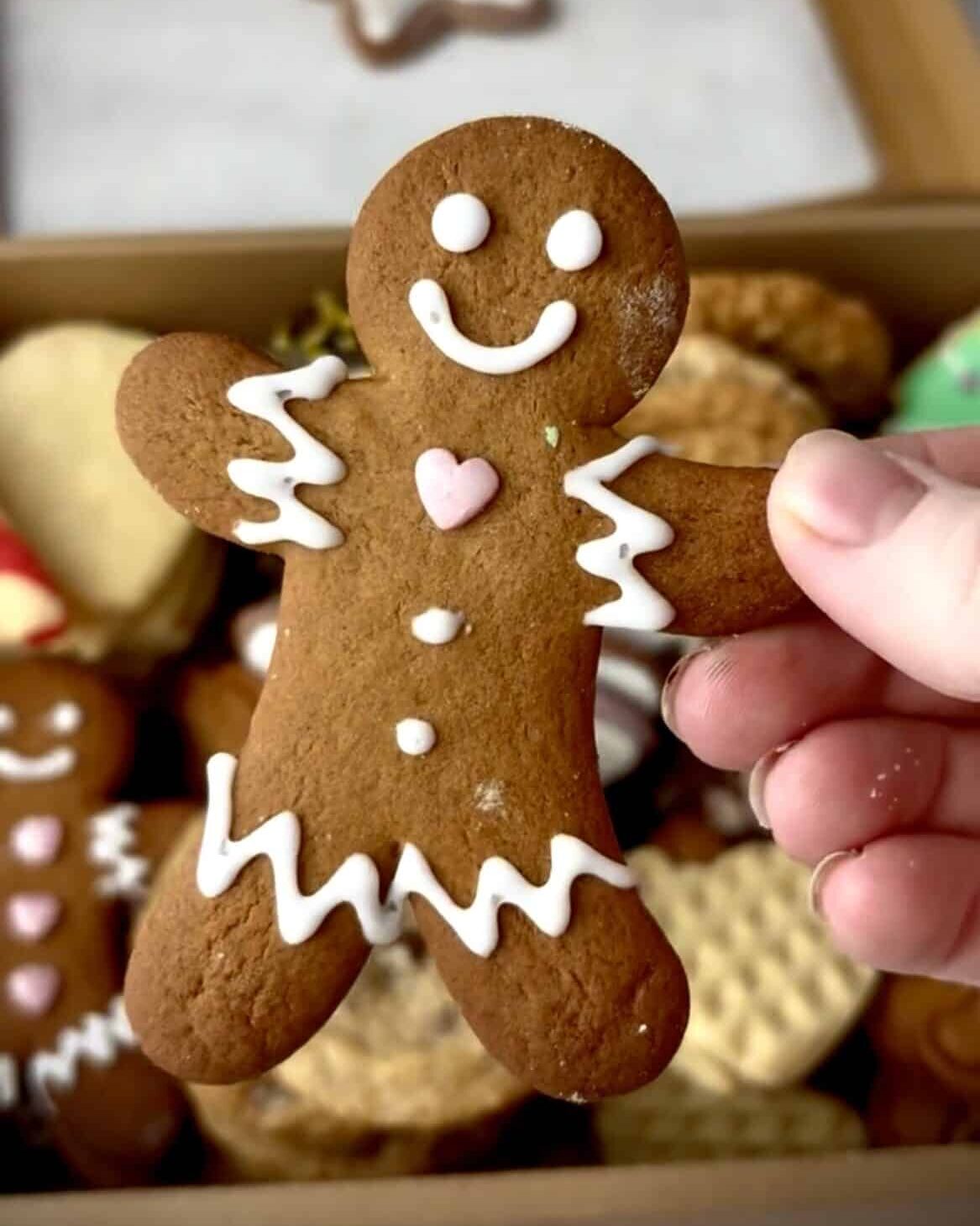 Gingerbread man with a little heart sprinkle as a bowtie.