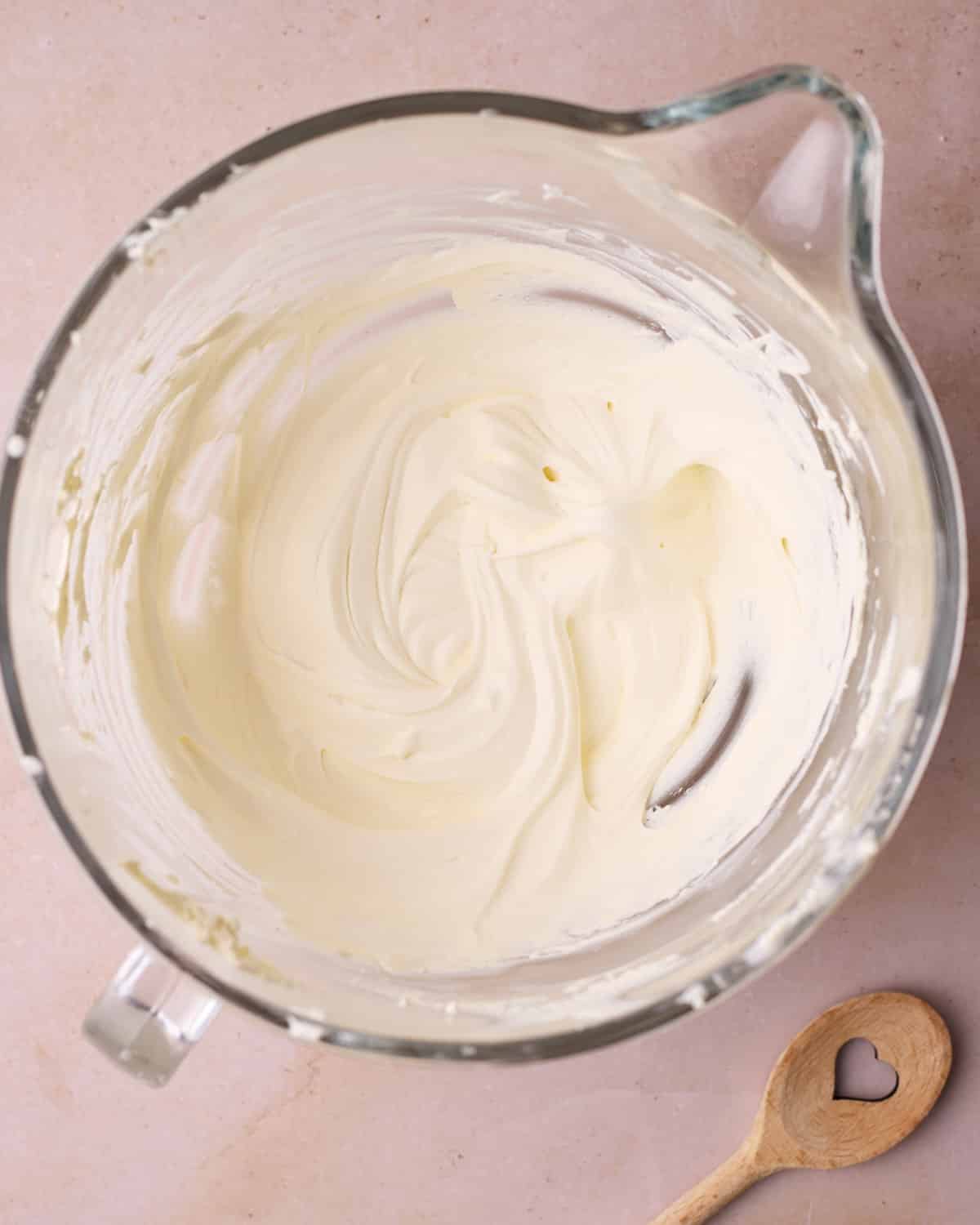Heavy cream in a glass bowl, whipped to soft peaks.