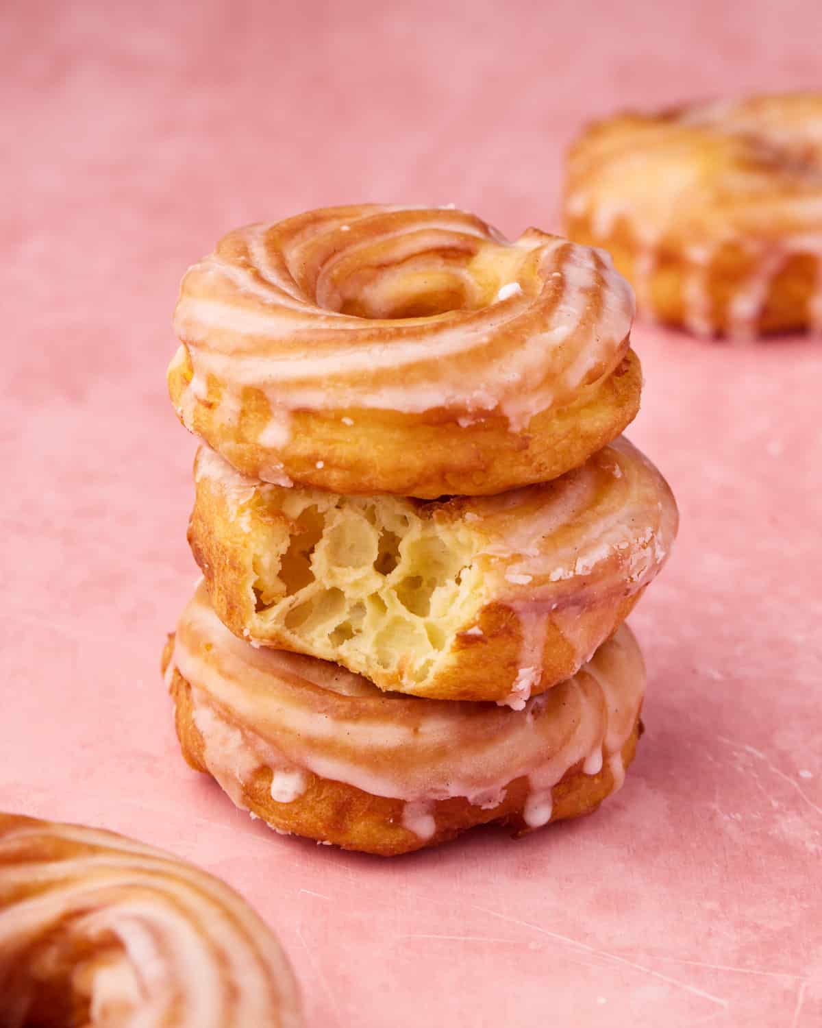 French crullers stacked on top of one another.