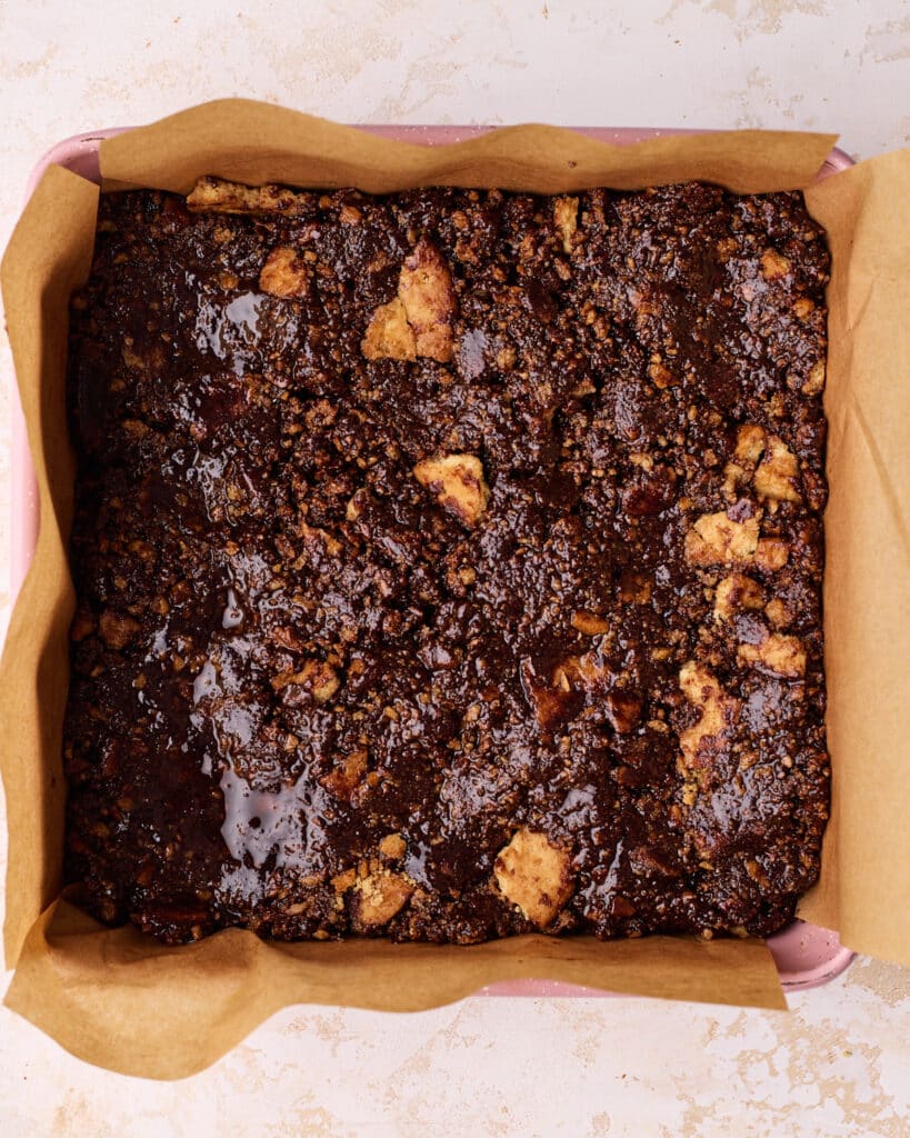 Tiffin mixture pressed into a square pan.