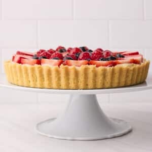 fruit tart from the side to show the shortbread crust (pate sablee).