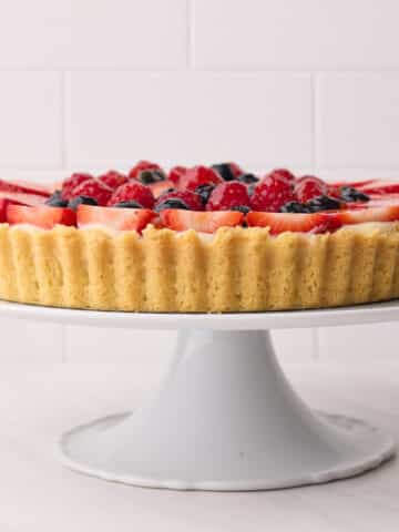 fruit tart from the side to show the shortbread crust (pate sablee).