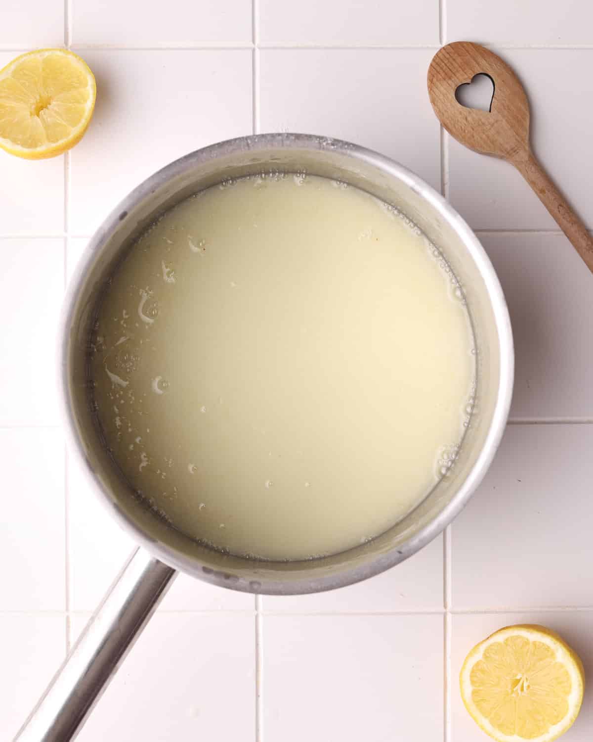Ingredients for the lemon filling in lemon meringue pie mixed together in a saucepan, ready to heat and dissolve the sugar.
