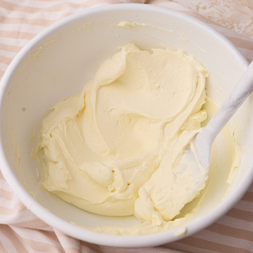mascarpone cream in a bowl, showing the silky texture.